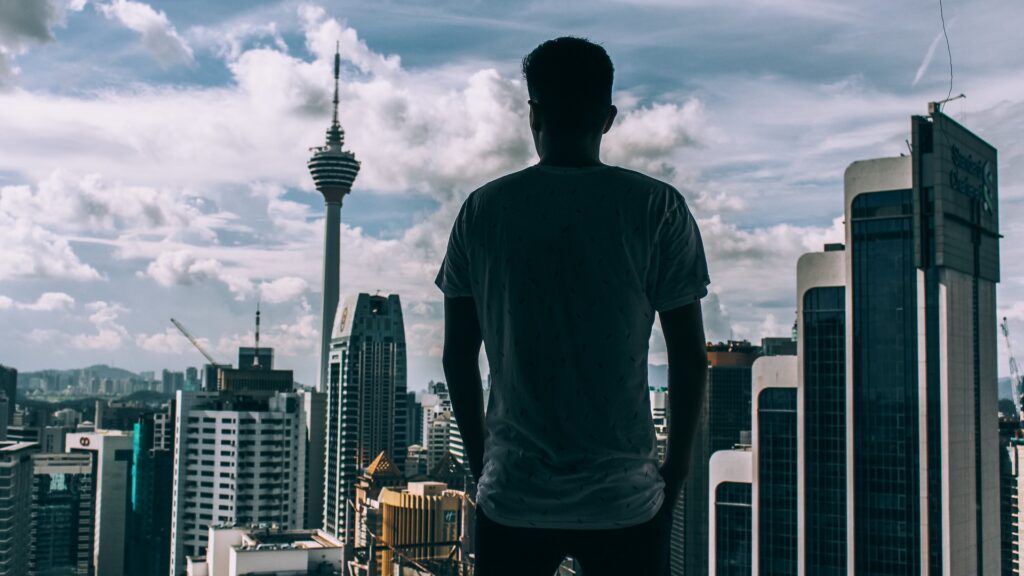 silhouette of man looking at skyline